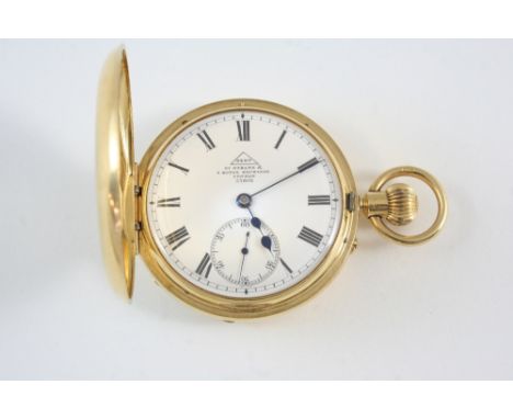 AN 18CT. GOLD HALF HUNTING CASED POCKET WATCH BY DENT the signed white enamel dial with Roman numerals and subsidiary seconds
