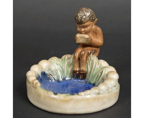 ROYAL DOULTON BIBELOT of a Faun playing Pan-Pipes. Impressed marks, Royal Doulton, 8753, FN potters mark. 4ins (10cms) high