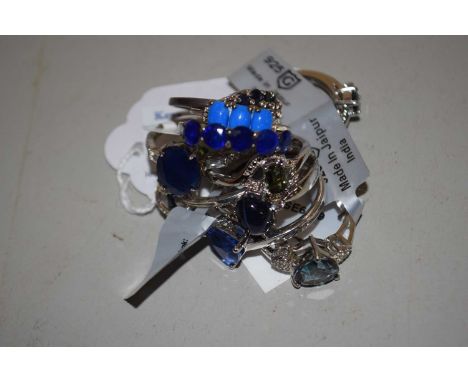 Ten silver and gemset rings: to include an oval sapphire and white stone ring, a star sapphire cabochon ring, topaz, kyanite 