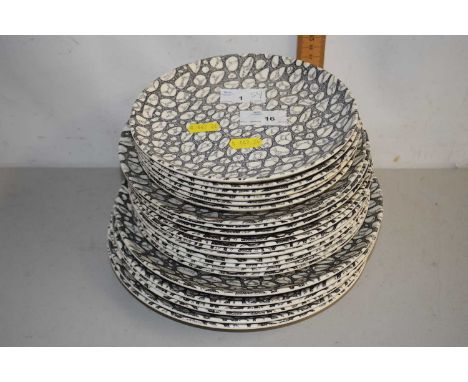 A quantity of Poole Pottery plates in the Black Pebble pattern, largest 25cm
