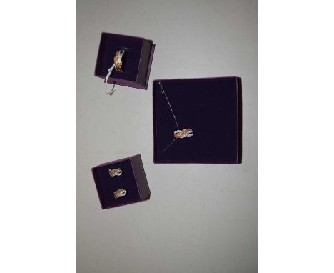 A silver and diamond necklace, earrings and ring suite: to include a tri-colour crossover pendant set with small round diamon