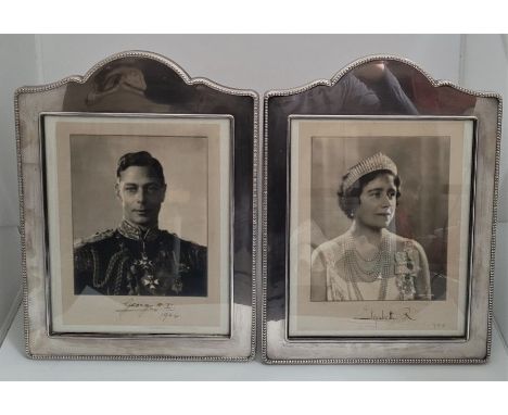 King George VI and Queen Elizabeth signed photographs; A pair of portrait photographs of King George VI and Queen Elizabet, e