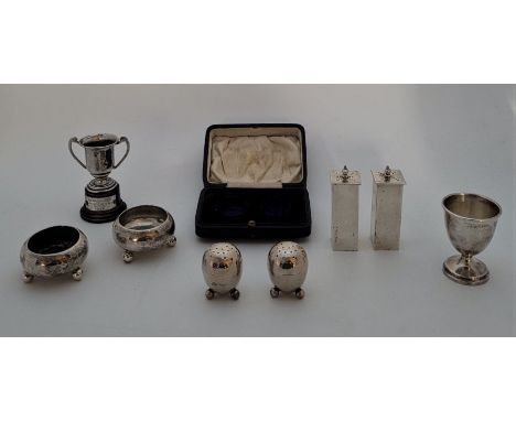 A small collection of silver tableware, to incude: a pair of silver Art Deco pepperettes, by A &amp; J Zimmerman Ltd, Birming