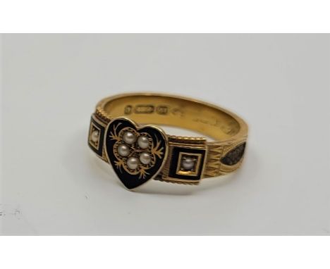 A Victorian 15ct. yellow gold, black enamel and pearl set memorial ring, having black cloissone enamel heart shape plaque set