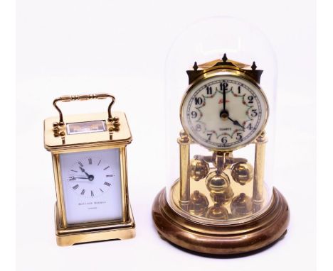 A Matthew Norman brass carriage clock with a quartz mantle clock under glass dome (2)