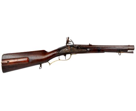 An Austrian rifled flintlock carbine, swamped hexagonal barrel 12 in., top flat inscribed 'Franz Xaveri Schas.... in Ferlach'