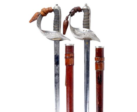 A Victorian 1897 pattern infantry officer's sword, blade 32.5 in. with light etching to the forte, regulation hilt with VR cy