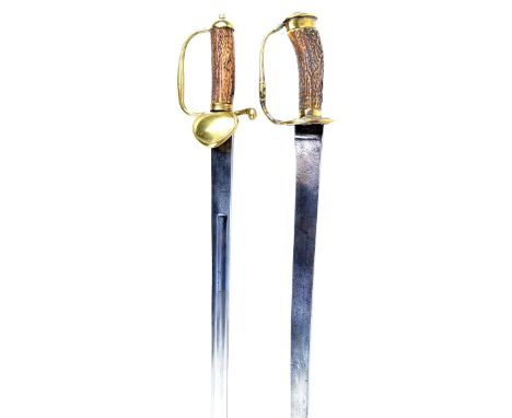 Two Continental hunting swords, the first with slightly curved single edged blade 20.5 in., struck with a mariner's cross mar