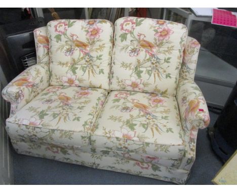 A Peter Gould two seater sofa together with a Windsor chair