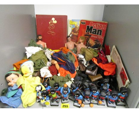 1960s and later Action Man related items to include three figures, clothes and shoes, Golly figures, two hand puppets and thr