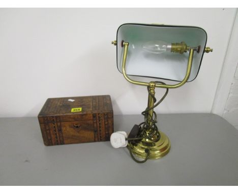 A Victorian walnut and German strapwork tea caddy, along with a late 20th century brass effect office lamp with a green glass
