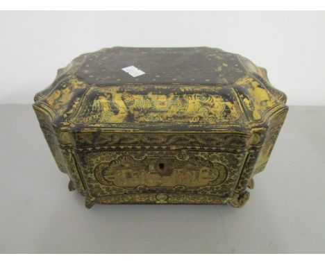 A 19th century Chinese lacquered tea caddy, with metal fitted interior and turned button finials and engraved decoration