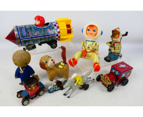 Daiya (Japan)- TPS (Japan) - Yoneya (Japan)-  An unboxed group of collectable tinplate and plastic toys. Lot includes a Daiya