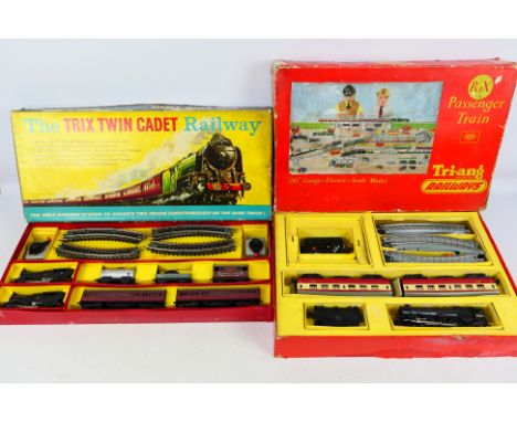 Trix - Tri-ang - Two boxed OO gauge train sets, comprising of a Trix Twin Cadet Railway 3-rail set - appears Very Good overal