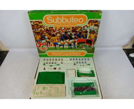 Subbuteo - A boxed 1986 Subbuteo 'World Cup Edition'. The set appears incomplete, but does come with pitch, a number of playe