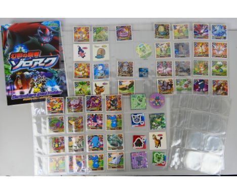 Pokemon - A Pokemon Decochara album containing approximately 53 Pokemon Daiichi Pan Bread / Decochara seal stickers and simil