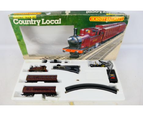 Hornby - A boxed HO/OO R671 Country Local Train Set. Item appears to be in a good-very good condition in a fair-good box; som