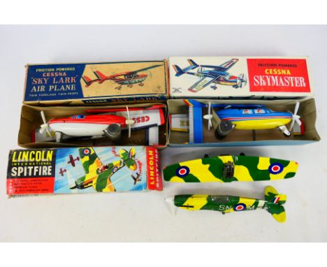 Yonezawa - Lincoln International - Alps - Three boxed vintage tinplate friction powered aircraft. Lot consists of Yonezawa Ce