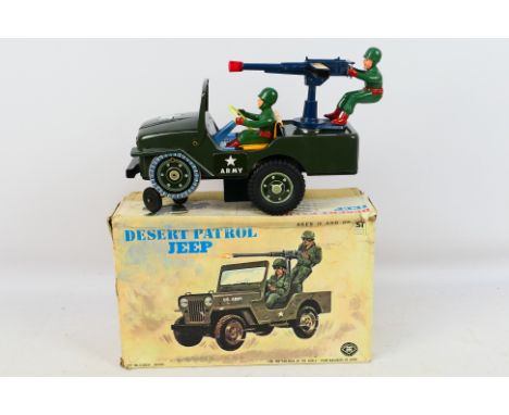 Modern Toys/ Masudaya (Japan) - A boxed Modern Toys #3672 battery operated, tinplate 'Desert Patrol Jeep'. The model in green