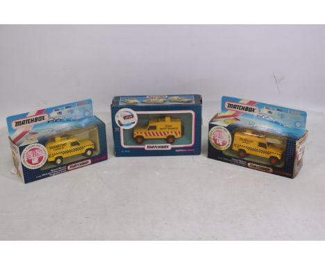 Matchbox Superkings - Three Boxed #K-144 diecast vehicles to include Airport Rescue and Road Maintenance vans with light up s