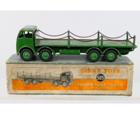 Dinky - A boxed #505 Foden Flat Truck with Chains. Item appear to be in a fair-good condition with some age and usage related