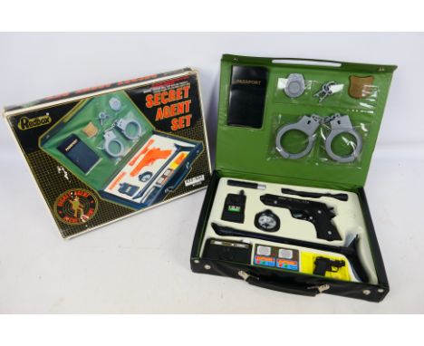 Redbox - A boxed Redbox #24106 'Secret Agent Set'. The set appears to be in Mint and complete condition, sitting within a Min