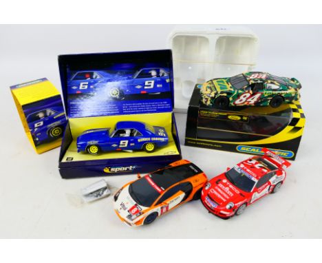 Scalextric - 4 x slot cars, Chevrolet Camaro # C2400A, Ford Taurus # C2585, Lamborghini Gallardo and Porsche 997. They show s