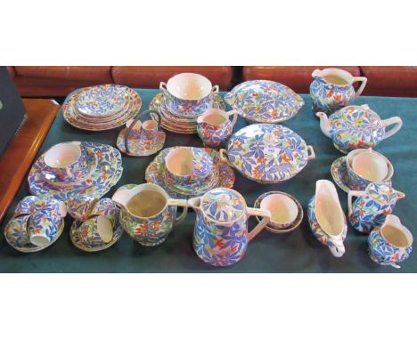 A Royal Tudor ware 'Fantasy' dinner service to include tureens, teapot, coffee pot, milk jug, gravy boat, dinner plates, side