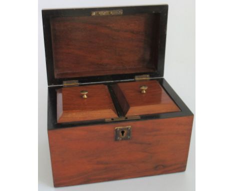 A mahogany tea caddy.