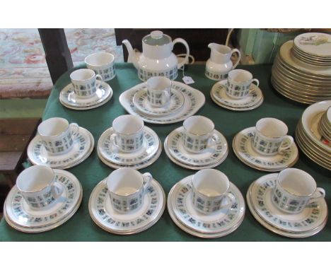 A Royal Doulton tapestry tea service, comprising: teapot, milk jug, sugar bowl, cake plates and ten trios.