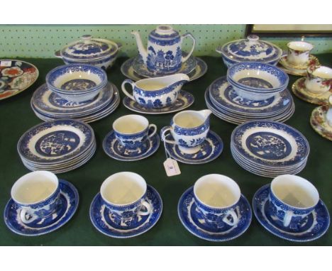 A large collection of Alfred Meakin Old Willow blue &amp; white china, comprising: tureens, dinner plates, side plates, soup 