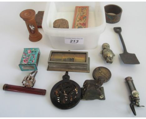 A quantity of miscellaneous items to include enamel matchbox cover, wooden egg timer, miniature spade, large knuckle duster, 