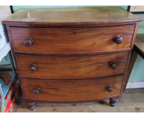 A Victorian bow front chest of three long graduated draws. 