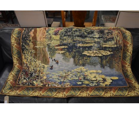 A modern machine-made tapestry wall hanging depicting ducks on a pond 160cm x 120cm.