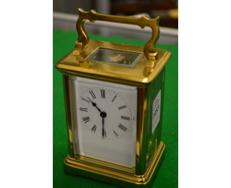 A brass carriage clock (lacking key).