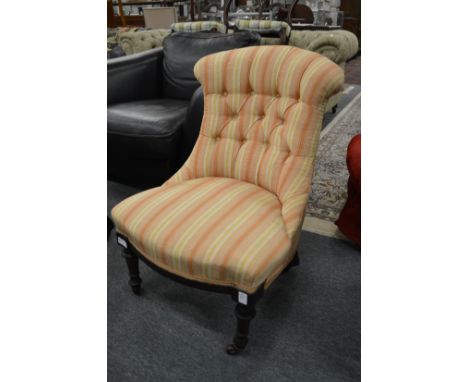 A Victorian button upholstered nursing chair.
