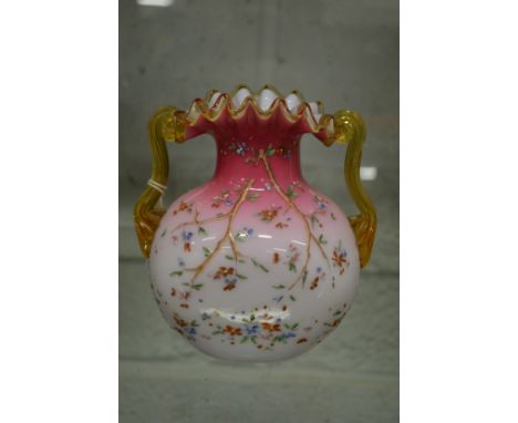 A good opaque glass frilly edged twin handled vase with enamel decoration.