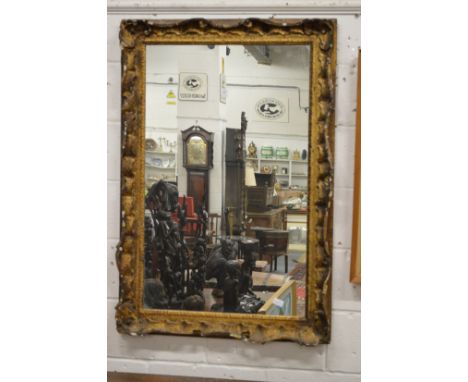A decorative gilt framed mirror.