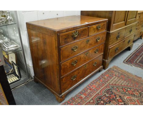 A good 18th century walnut 'caddy top' straight front chest of drawers comprising two short and three graduated long drawers 