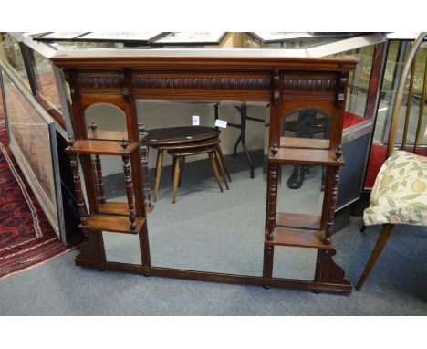 A Victorian walnut oval mantel mirror with shelves.