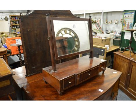 A George III mahogany dressing table mirror.