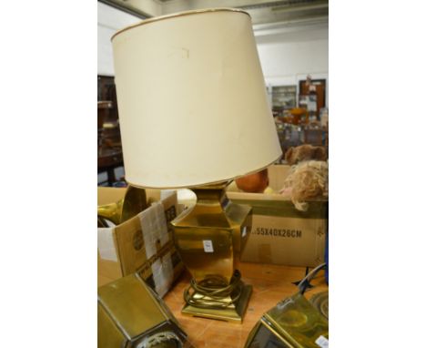 A large brass table lamp.