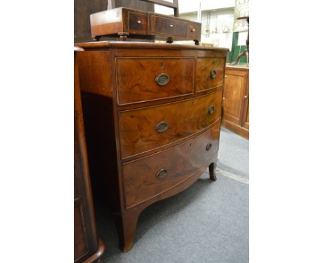 A 19th century mahogany bow front chest of two short and two long drawers on bracket feet.