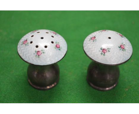 A pair of silver and enamel decorated mushroom shape salt and peppers.