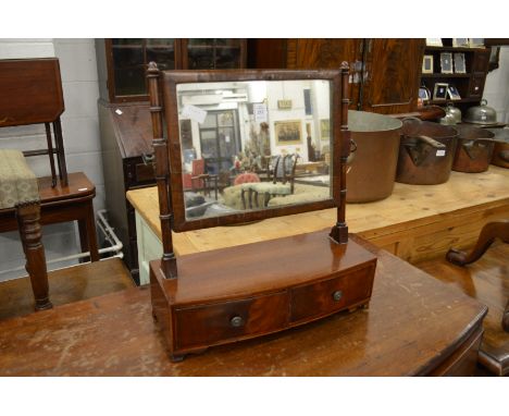 A mahogany two drawer dressing table mirror.