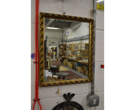 A small gilt framed mirror.