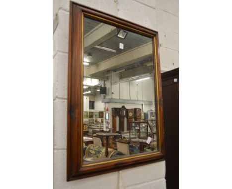A modern rectangular wall mirror.