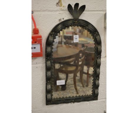 A small metal framed mirror.
