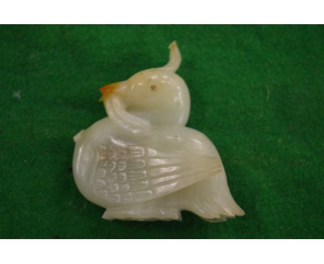 A carved jade duck.