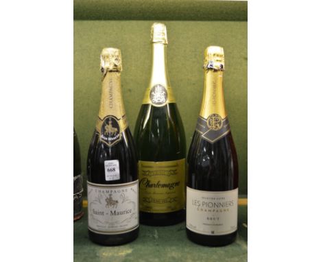 Two bottles of champagne and a magnum of sparkling wine.